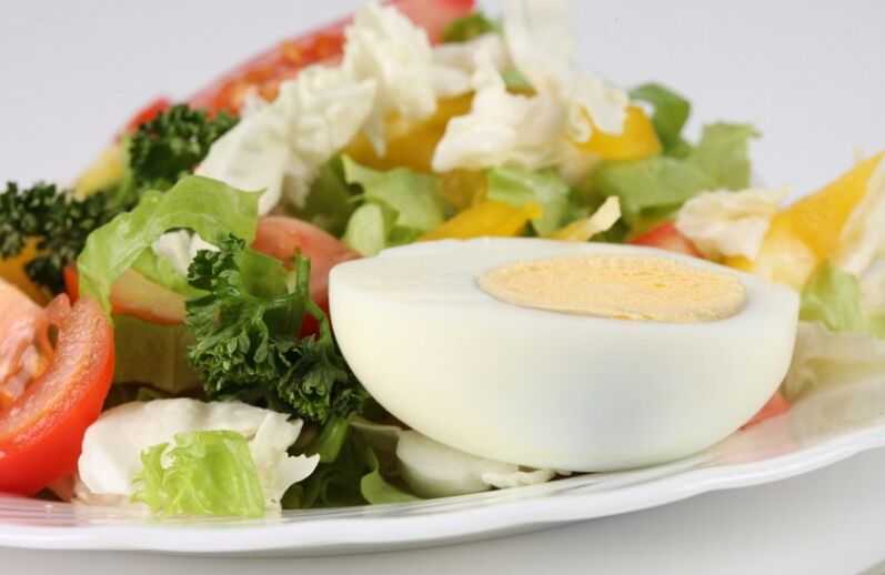 Fresh vegetable salad with boiled egg on Maggi diet menu